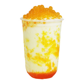 A tall plastic cup filled with boba and Asian tea