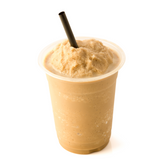 An iced coffee frappe with a paper straw