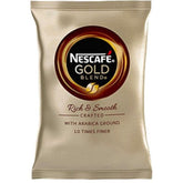 A single gold bag of nescafe vending coffee
