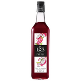 A tall glass bottle of 1883 Routin Dragonfruit Syrup