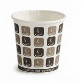 A white paper hot beverage cup with a repeating pattern of brown and beige coffee cup icons and a black band at the bottom reading 'CAUTION HOT BEVERAGE'.