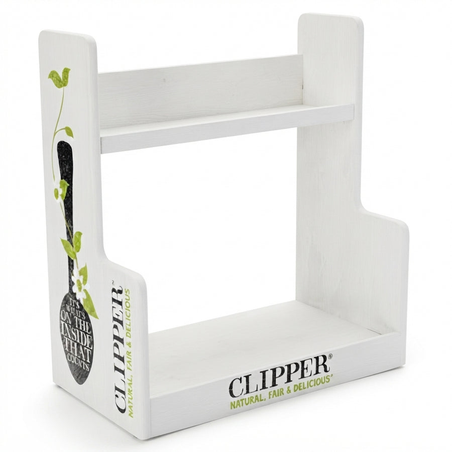 A white wooden display stand with two tiers, featuring printed branding for Clipper on the front and side panels with a decorative olive branch illustration.