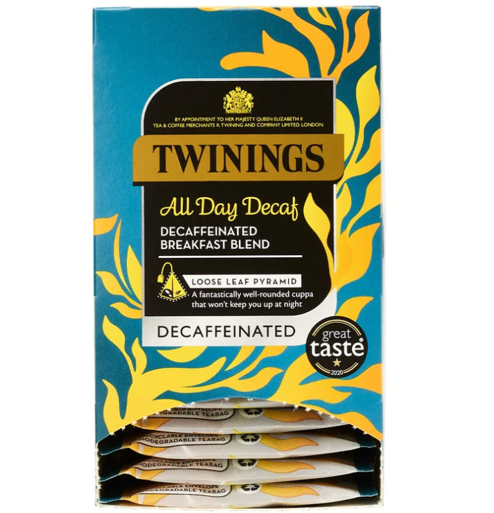 A box of Twinings All Day Decaf Decaffeinated Breakfast Blend loose leaf tea, featuring a blue and yellow patterned design with individual tea packets visible at the bottom.